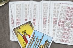 Tarot card reader arranges cards in a card spread. Product Image 1