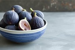 Fresh figs in a blue bowl on gray surface Product Image 1