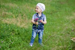 Cute baby girl on a walk in the Park Product Image 1