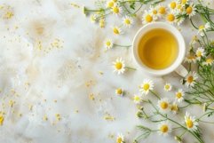 Cup of herbal chamomile tea surrounded by fresh chamomile fl Product Image 1