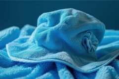 High-quality close-up image of a blue towel with intricate t Product Image 1