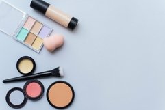 Concealer, blush, foundation and powder on a blue background Product Image 1