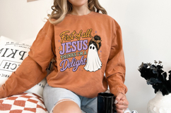 Retro Christian ghost graphic with distressed lettering, Halloween-inspired colors, and a playful faith-centered message for apparel and crafts.