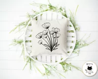 black flowers outline drawing on a white pillow