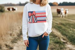 Americana bow artwork with red gingham ribbon tails and a whimsical patchwork flag background featuring navy stars, blue stripes, florals, and polka dot patterns.