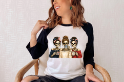 Red, white and blue digital illustration of three skeleton friends gathered for coffee in a detailed, grown-up watercolor style.