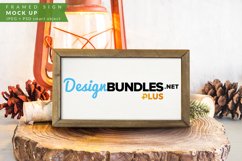 Framed Christmas Sign Mock up with pinecones and logs