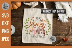 Friendsgiving 2022 with wreath Thankful For You SVG shown on a canvas tote bag as a project idea.  Thanksgiving with friends SVG, DXF, PNG, and JPEG file types included.