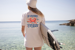 Retro beach themed shirt design with red crab illustration surrounded by shells, starfish, rope and ocean graphics for summer vacation apparel.