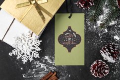 gift-tag-mockup-featuring-a-snowy-christmas-setting-with Arabesque Tile Ornament design