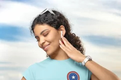 gildan-crop-top-mockup-of-a-smiling-woman-posing-in-a-balcony-with 4th of july graphics