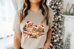 Hand-painted style Christmas PNG featuring gingerbread bakers, chocolate chip cookies, red-striped kitchen linens and evergreen accents in a playful seasonal baking scene.