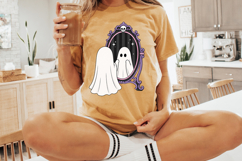 Cute ghost artwork showing a ghost looking into a haunted mirror framed with gothic purple scrollwork and Halloween-inspired details.