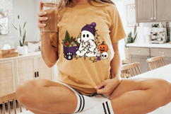 Cute festive ghost illustration with colorful Christmas lights, ornaments, pumpkin, hot cocoa mug, and winter accessories for holiday crafting projects.