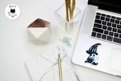 skeleton sticker for Halloween on a light silver notebook