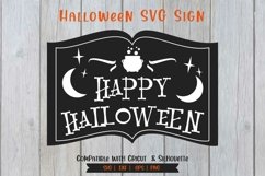 witch book saying happy halloween