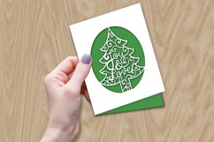 hand holding christmas papercut card