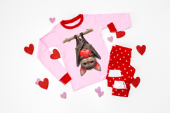 A cute illustrated bat hanging upside down from a branch while holding a bright red heart. The bat has soft brown fur, large red eyes, and textured wings. Digital PNG artwork shown on a dark background for contrast.
