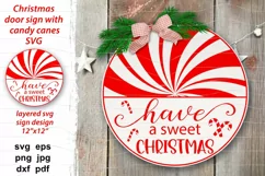 Cute round Xmas door sign, Have a sweet Christmas quote with red and white peppermint candy canes. Traditional Christmas food, template for round door or porch sign, plate, pillow. Festive home decoration. 