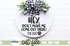 Dog Welcome SVG shown on a round wood door hanger