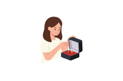 A woman joyfully opening a black jewelry box revealing a gol Product Image 1