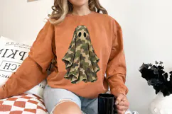 Single ghost PNG design combining classic Halloween imagery with earthy camouflage colors and a thick hand-painted appearance.