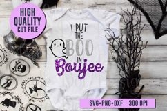 I Put the Boo in Boujee design on white baby shirt with black and white halloween decor on wood background