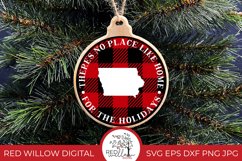 Round buffalo plaid Christmas Ornament design for Iowa with the phrase &quot;there's no place like home for the holidays&quot; displayed on a wood ornament hung from a Christmas tree. 