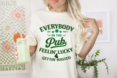 Beige St Patrick’s Day shirt design reading “Everybody In The Pub Feelin’ Lucky &amp; Gettin’ Wasted” in bold green typography with shamrock accents.