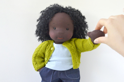 Knitted cardigan and matching booties for 14-16 inch (36-40 cm) Waldorf dolls, including PDF patterns and step-by-step tutorials for creating handmade doll clothes, perfect for DIY knitting projects, printable and beginner-friendly.