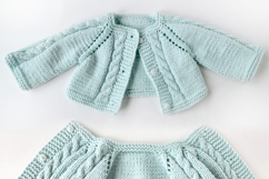 Knitted cardigan and matching booties for 14-16 inch (36-40 cm) Waldorf dolls, including PDF patterns and step-by-step tutorials for creating handmade doll clothes, perfect for DIY knitting projects, printable and beginner-friendly.