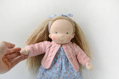 Knitted cardigan and matching booties for 11-13 inch (28-33 cm) Waldorf dolls, including PDF patterns and step-by-step tutorials for creating handmade doll clothes, perfect for DIY knitting projects, printable and beginner-friendly.