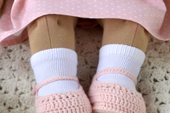 Knitted cardigan and matching booties for 14-16 inch (36-40 cm) Waldorf dolls, including PDF patterns and step-by-step tutorials for creating handmade doll clothes, perfect for DIY knitting projects, printable and beginner-friendly.