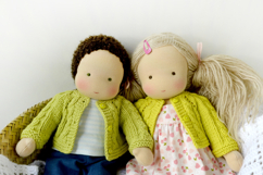 Knitted cardigan and matching booties for 11-13 inch (28-33 cm) Waldorf dolls, including PDF patterns and step-by-step tutorials for creating handmade doll clothes, perfect for DIY knitting projects, printable and beginner-friendly.