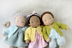 Knitted cardigan and matching booties for 14-16 inch (36-40 cm) Waldorf dolls, including PDF patterns and step-by-step tutorials for creating handmade doll clothes, perfect for DIY knitting projects, printable and beginner-friendly.