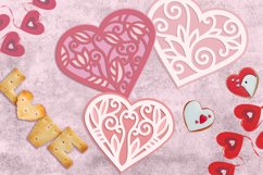 layered laser cut hearts on table with valentines decorations