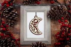layered moon ornament in frame