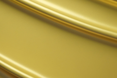A shiny, reflective gold background with a smooth, luxurious Product Image 1