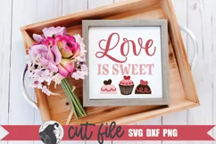cute Valentine candy SVG shown n a wood sign