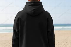 Black hoodie on beach T-shirt Mockup Design Product Image 1