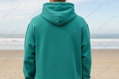 Teal hoodie on beach T-shirt Mockup Design Product Image 1