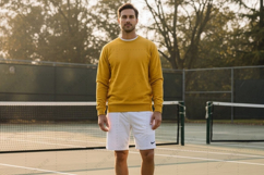 Men's tennis casual wear - yellow sweater and white shorts Product Image 1