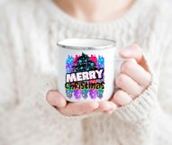 colorful Merry Christmas png design with a decorated black Christmas tree drawing on a white mug held by a woman