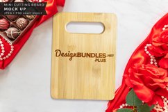 mockup of cutting board with chocolate truffles and red roses for valentine's day, anniversary, love