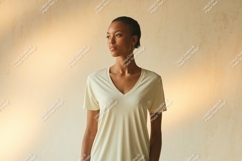 Woman wearing light yellow v-neck t-shirt image Product Image 1