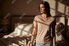 Woman wearing beige v-neck t-shirt casual Product Image 1