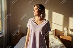Woman wearing lavender t shirt in sunlit room vneck Product Image 1