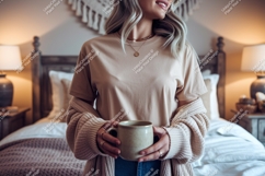 Woman wearing beige t shirt and cardigan holding mug Product Image 1
