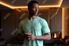Man wearing mint t shirt holding mug image Product Image 1