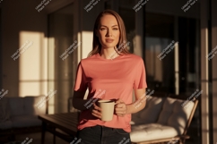 Woman wearing coral t shirt holding mug image Product Image 1